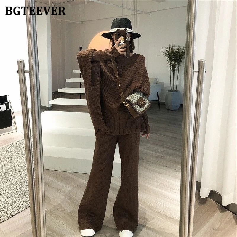 Elevate your winter wardrobe with our chic Knitted 2-Piece Set for women, boasting a turtleneck collar and high-waisted wide-leg pants. This cozy loungewear coy exudes both comfort and sophistication