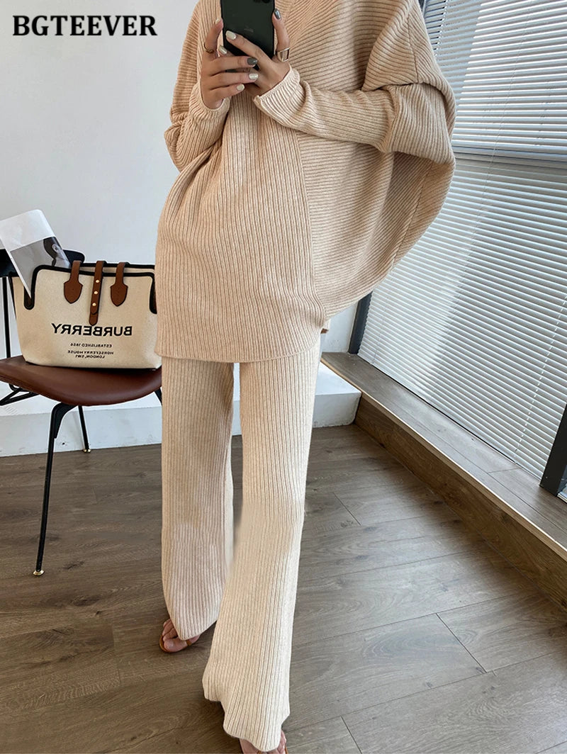 Elevate your winter wardrobe with our chic Knitted 2-Piece Set for women, boasting a turtleneck collar and high-waisted wide-leg pants. This cozy loungewear coy exudes both comfort and sophistication