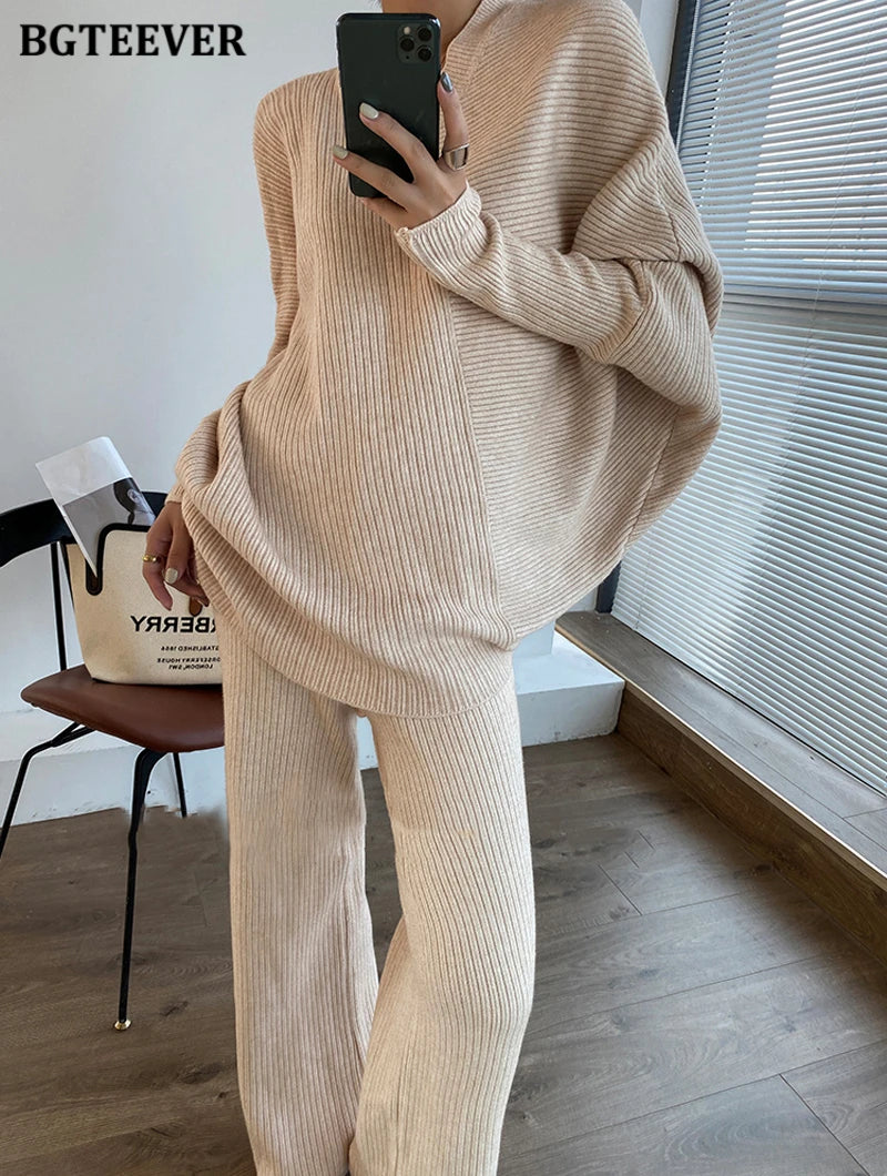 Elevate your winter wardrobe with our chic Knitted 2-Piece Set for women, boasting a turtleneck collar and high-waisted wide-leg pants. This cozy loungewear coy exudes both comfort and sophistication