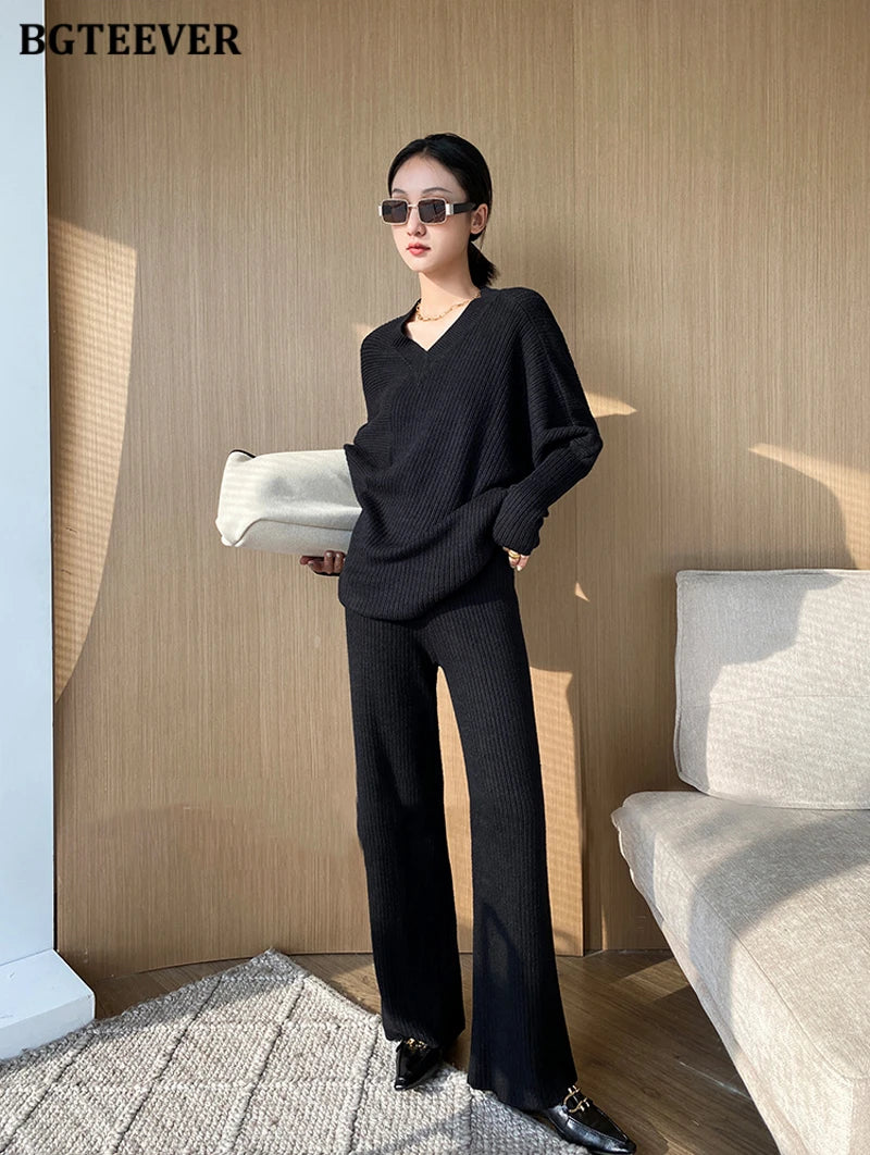 Elevate your winter wardrobe with our chic Knitted 2-Piece Set for women, boasting a turtleneck collar and high-waisted wide-leg pants. This cozy loungewear coy exudes both comfort and sophistication