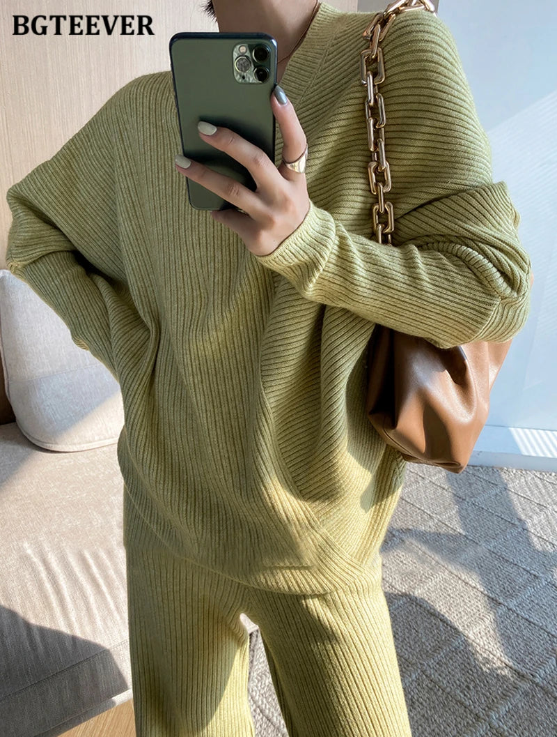 Elevate your winter wardrobe with our chic Knitted 2-Piece Set for women, boasting a turtleneck collar and high-waisted wide-leg pants. This cozy loungewear coy exudes both comfort and sophistication