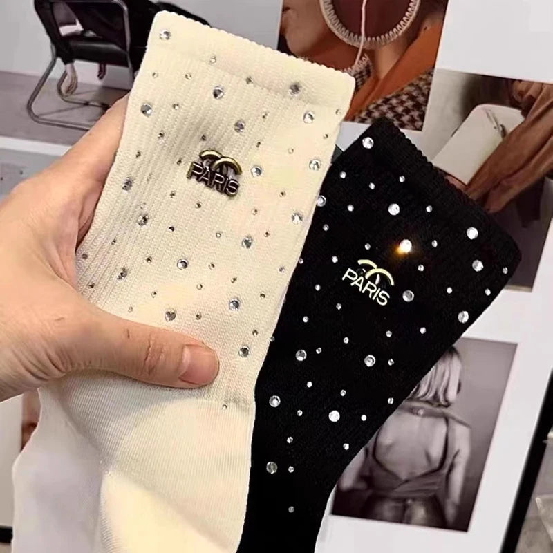 Luxurious Rhinestone socks for women, featuring a sophisticated black and white design and adorned with a chic metal label.