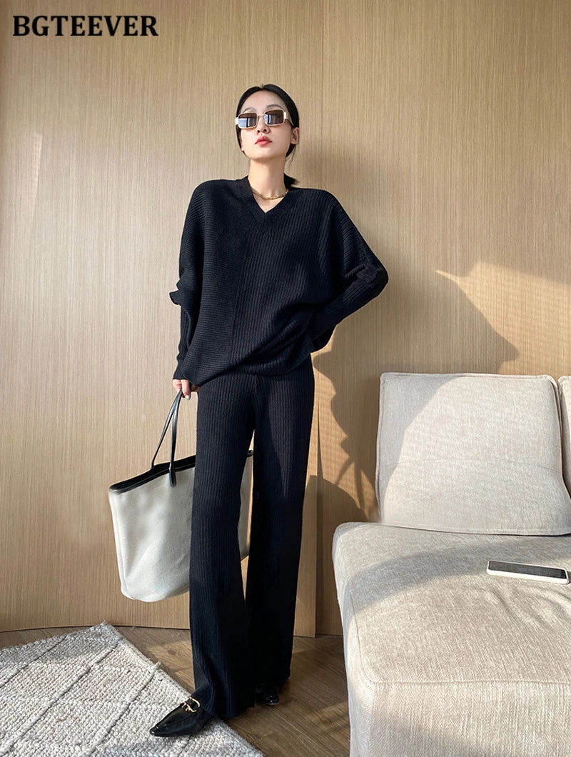 Elevate your winter wardrobe with our chic Knitted 2-Piece Set for women, boasting a turtleneck collar and high-waisted wide-leg pants. This cozy loungewear coy exudes both comfort and sophistication