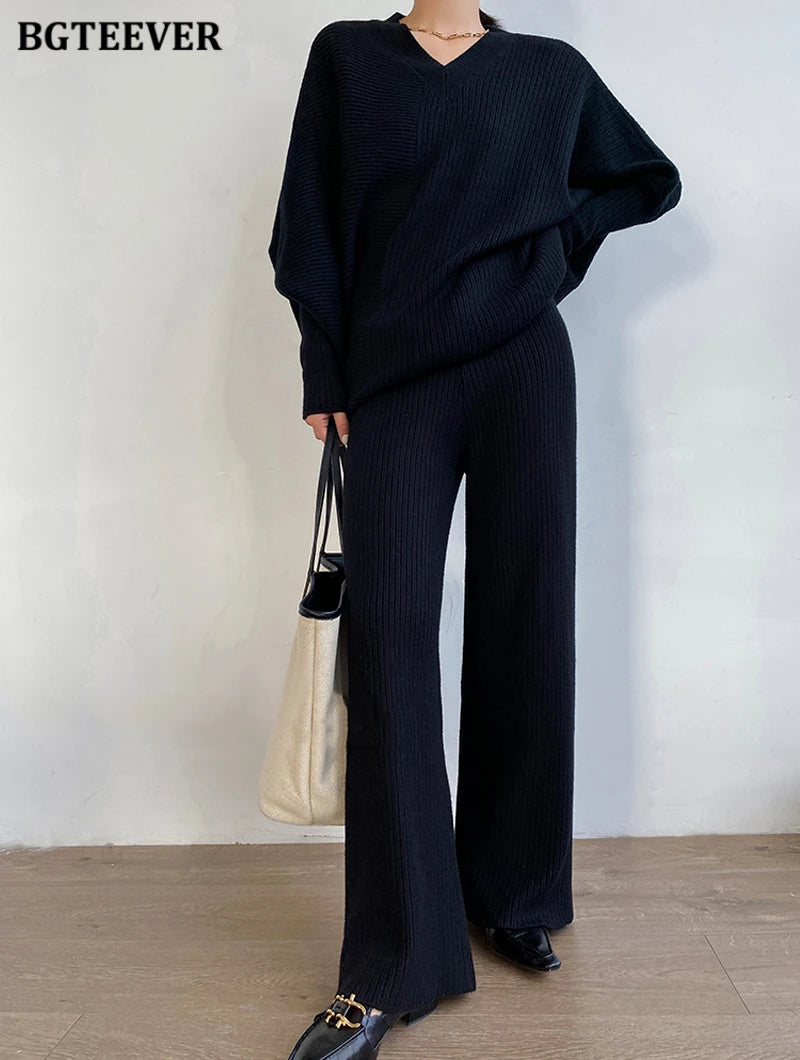 Elevate your winter wardrobe with our chic Knitted 2-Piece Set for women, boasting a turtleneck collar and high-waisted wide-leg pants. This cozy loungewear coy exudes both comfort and sophistication