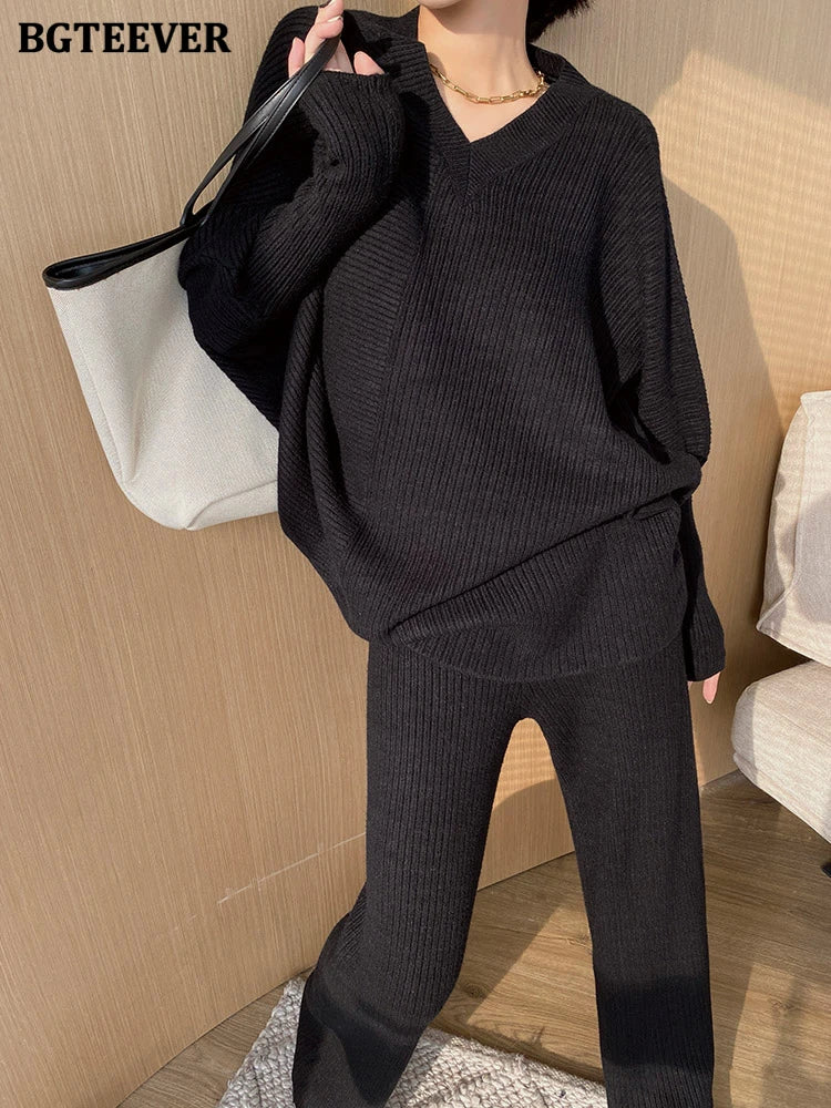 Elevate your winter wardrobe with our chic Knitted 2-Piece Set for women, boasting a turtleneck collar and high-waisted wide-leg pants. This cozy loungewear coy exudes both comfort and sophistication