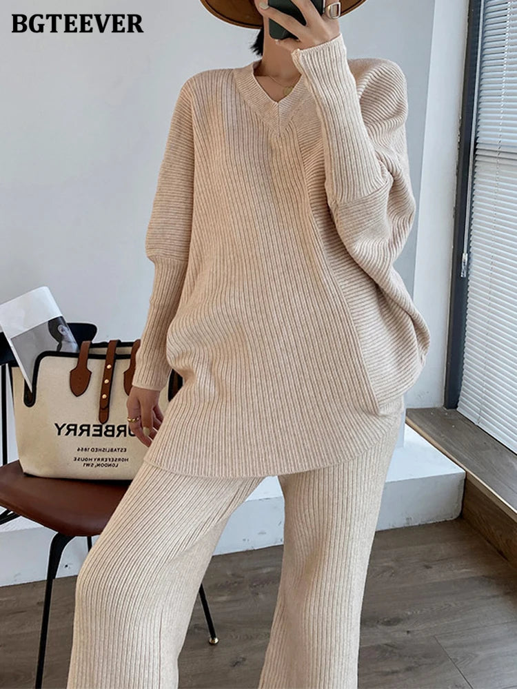 Elevate your winter wardrobe with our chic Knitted 2-Piece Set for women, boasting a turtleneck collar and high-waisted wide-leg pants. This cozy loungewear coy exudes both comfort and sophistication