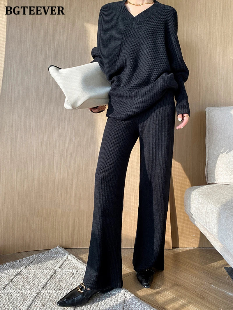 Elevate your winter wardrobe with our chic Knitted 2-Piece Set for women, boasting a turtleneck collar and high-waisted wide-leg pants. This cozy loungewear coy exudes both comfort and sophistication