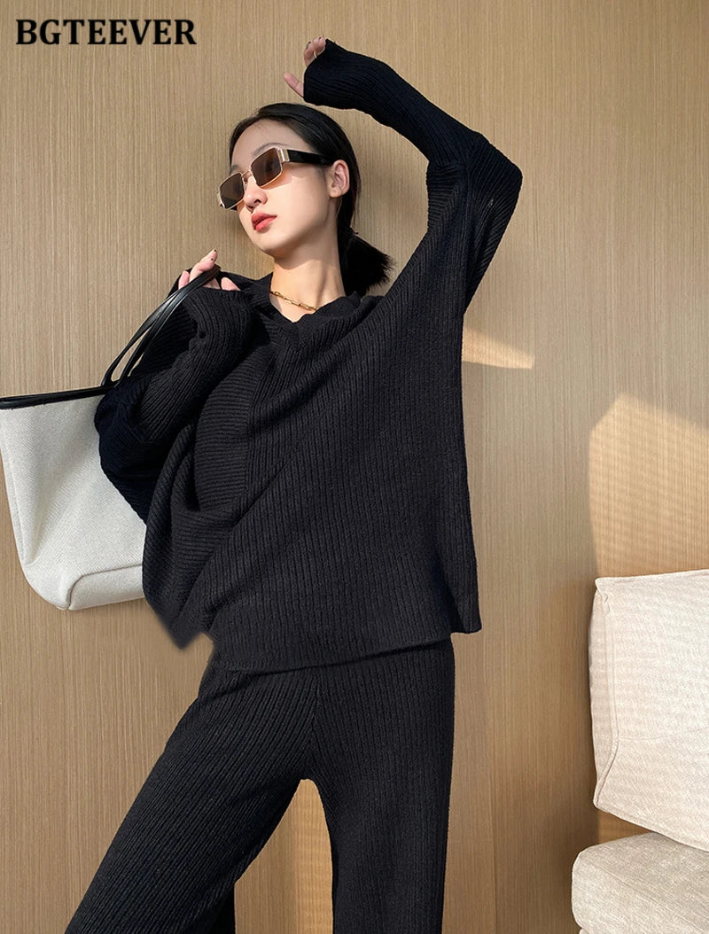 Elevate your winter wardrobe with our chic Knitted 2-Piece Set for women, boasting a turtleneck collar and high-waisted wide-leg pants. This cozy loungewear coy exudes both comfort and sophistication